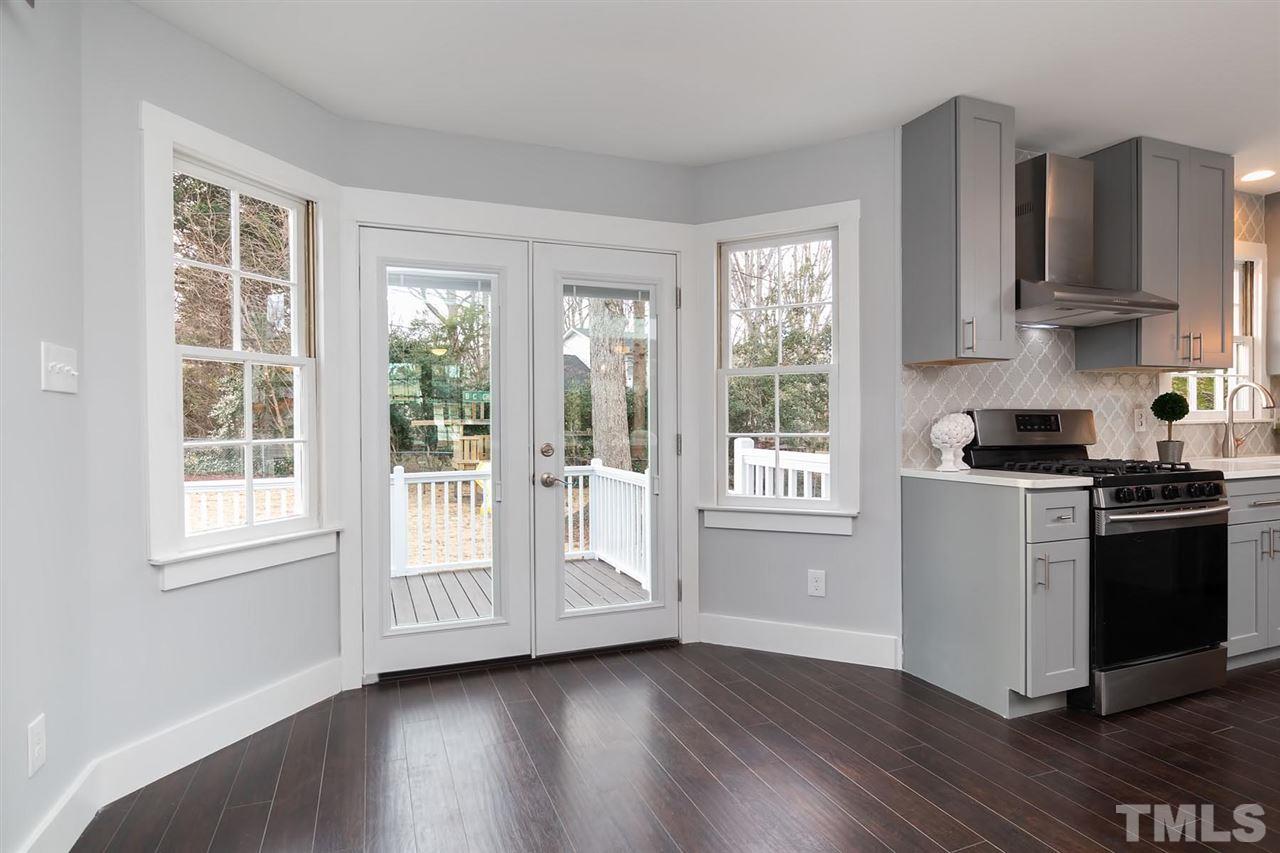 5501 Knollwood Road Raleigh, NC 27609 - Photo 9 of 25 a kitchen with wooden floors and appliances