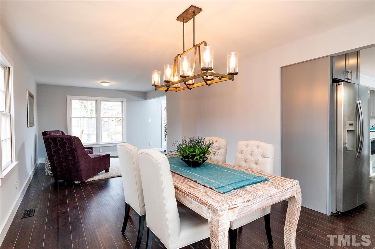 5501 Knollwood Road Raleigh, NC 27609 - Photo 10 of 25 a view of a dining room with furniture window and wooden floor
