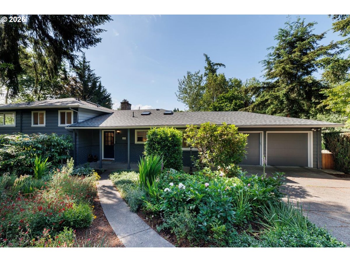 175 Northwest 95th Avenue Portland, OR 97229 - Photo 2 of 46 a view of a house with potted plants and large tree