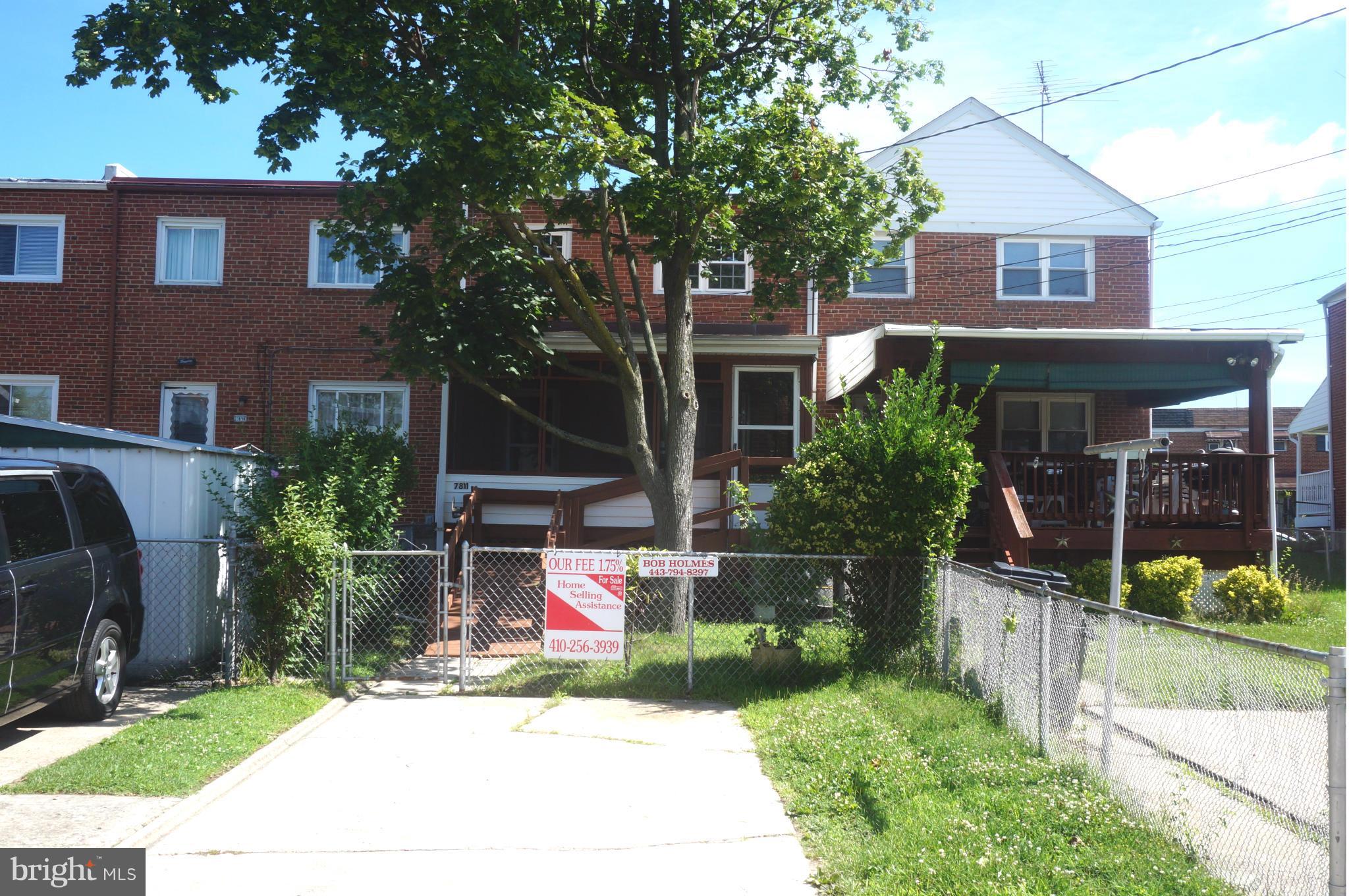 7811 Kavanagh Road Baltimore, MD 21222 - Photo 4 of 27 a front view of a house with garden