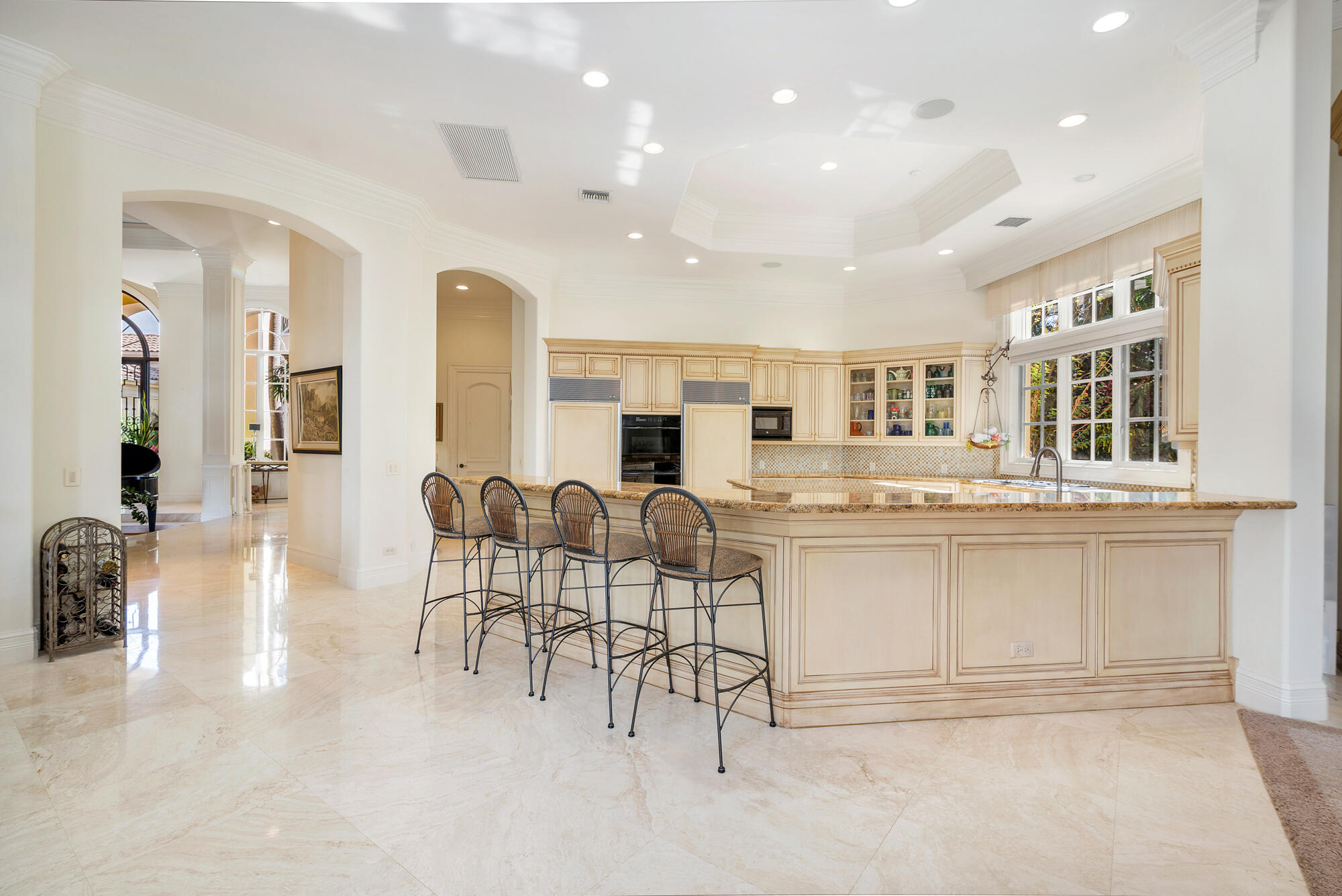 19223 North Riverside Drive Tequesta, FL 33469 - Photo 15 of 83 a living room with stainless steel appliances kitchen island granite countertop furniture and a kitchen view