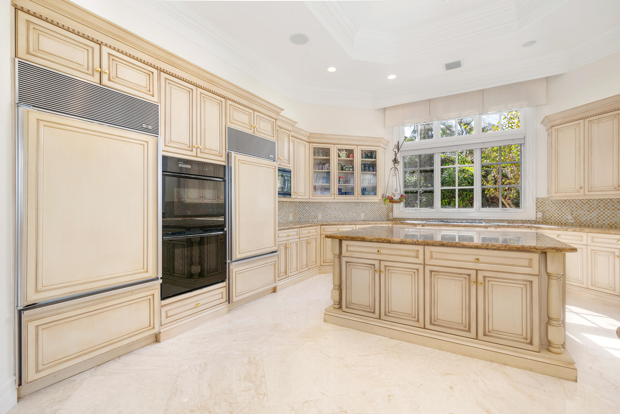 19223 North Riverside Drive Tequesta, FL 33469 - Photo 17 of 83 a kitchen with granite countertop a refrigerator and a sink