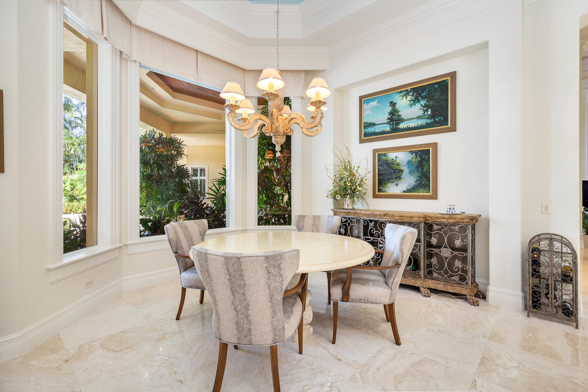 19223 North Riverside Drive Tequesta, FL 33469 - Photo 19 of 83 a view of a dining room with furniture a chandelier and a window