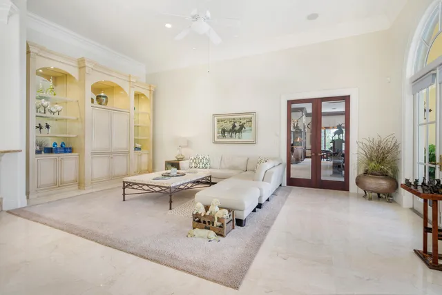 a bedroom with a bed and a television