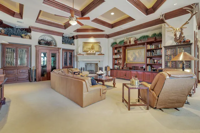 a view of a hallway with wooden floor and entryway