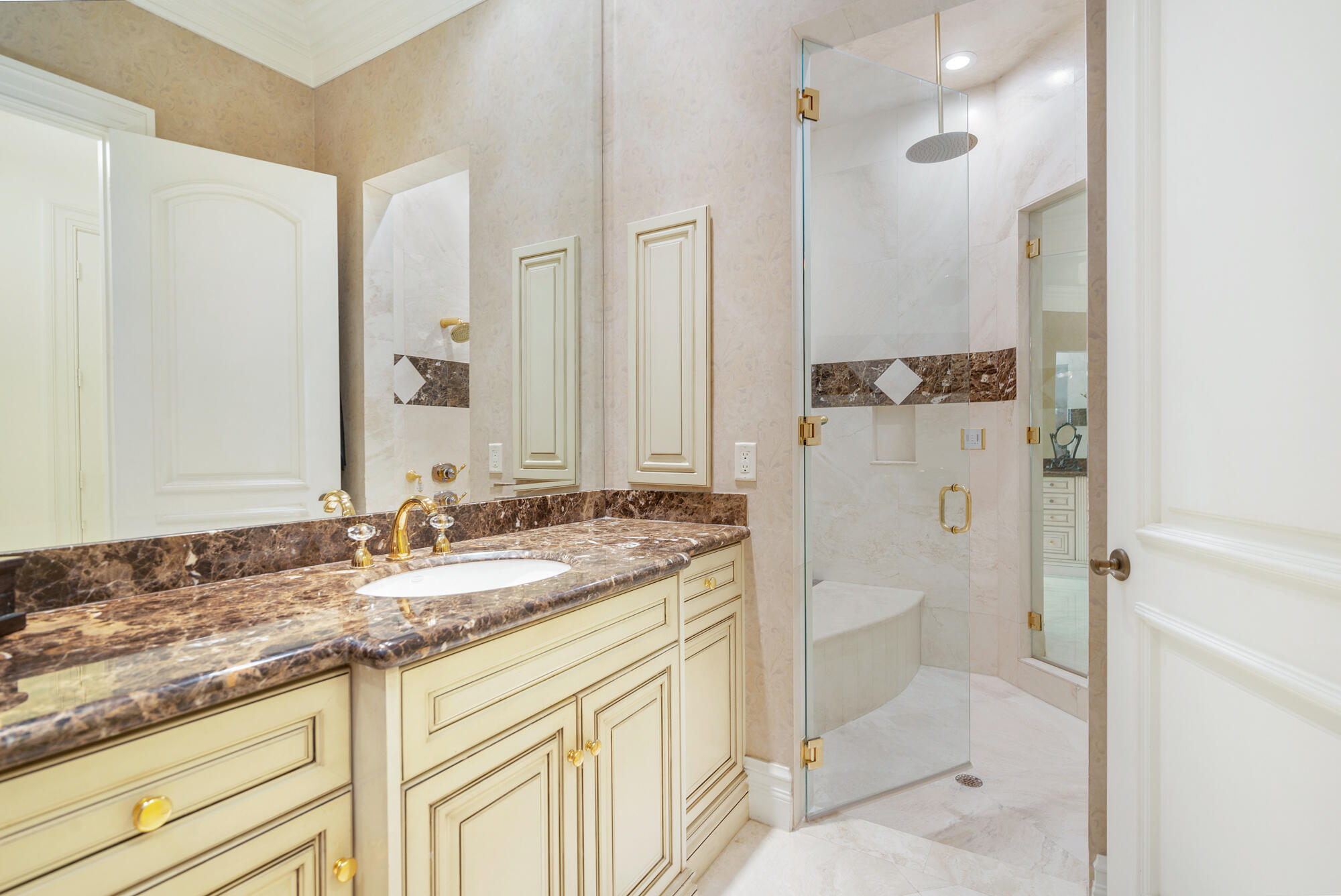 19223 North Riverside Drive Tequesta, FL 33469 - Photo 32 of 83 a bathroom with a granite countertop sink and a mirror