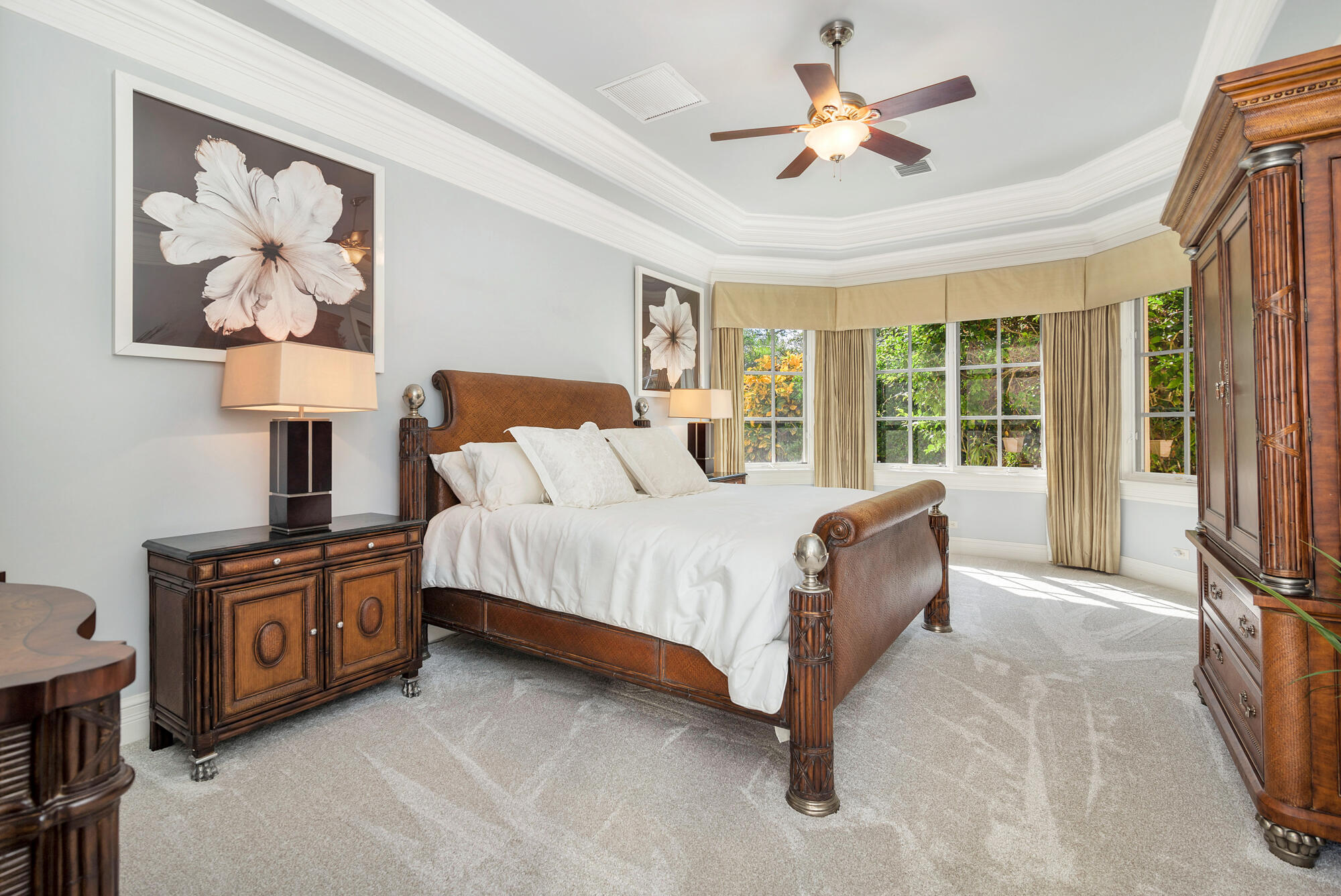 19223 North Riverside Drive Tequesta, FL 33469 - Photo 33 of 83 a bedroom with a bed dresser and a large window