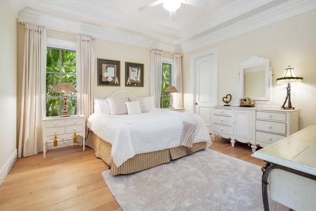 a view of a house with a yard potted plants