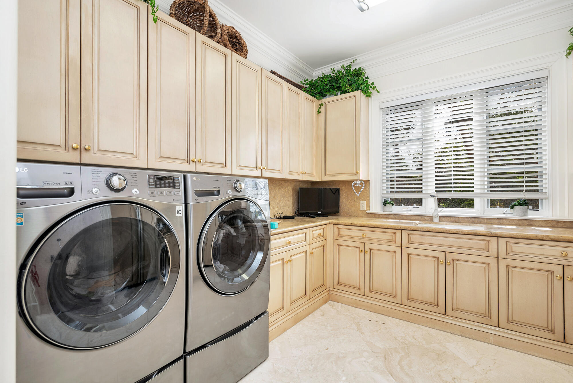 19223 North Riverside Drive Tequesta, FL 33469 - Photo 44 of 83 a utility room with sink dryer and washer