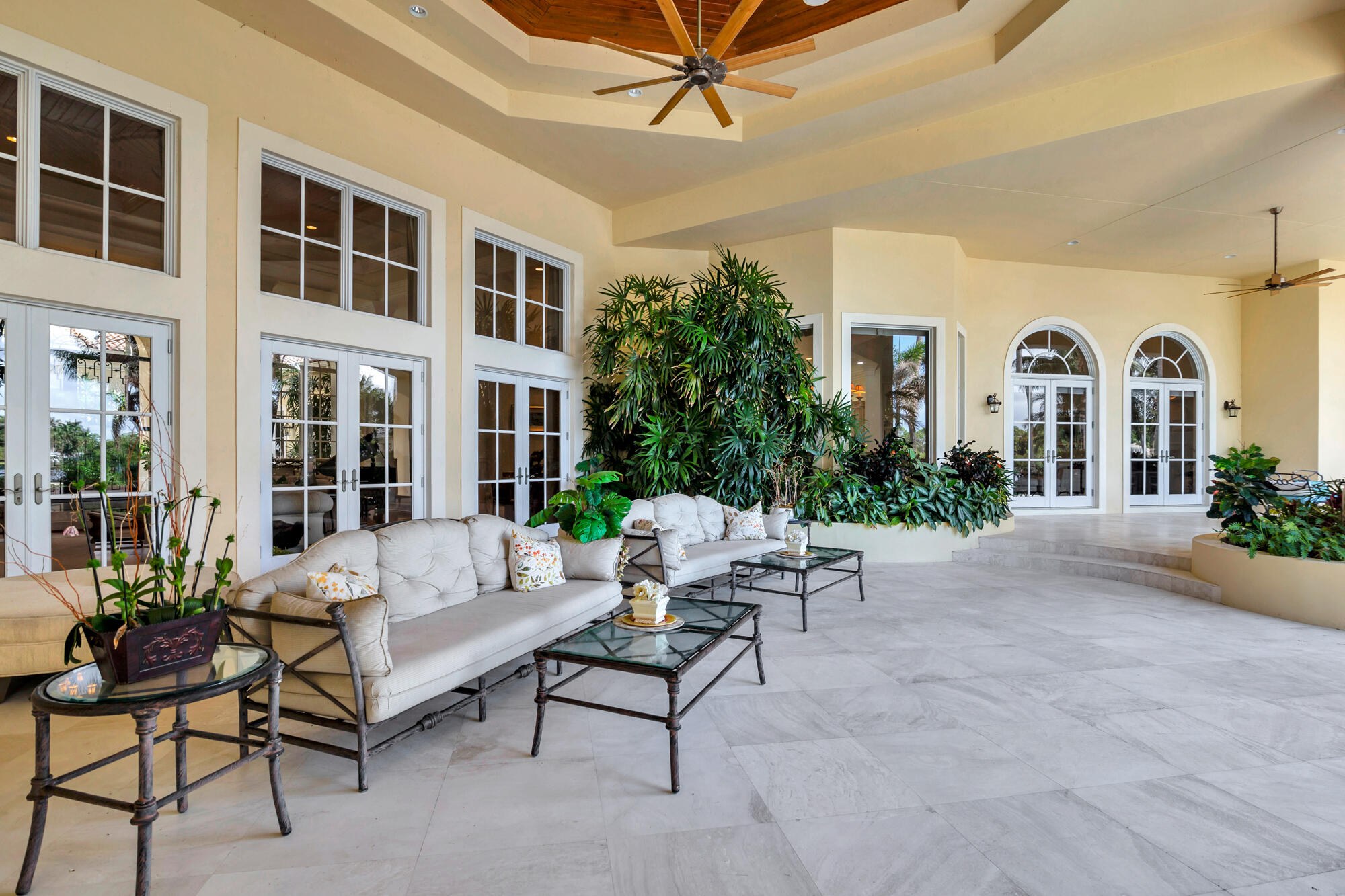 19223 North Riverside Drive Tequesta, FL 33469 - Photo 47 of 83 a building outdoor space with patio furniture