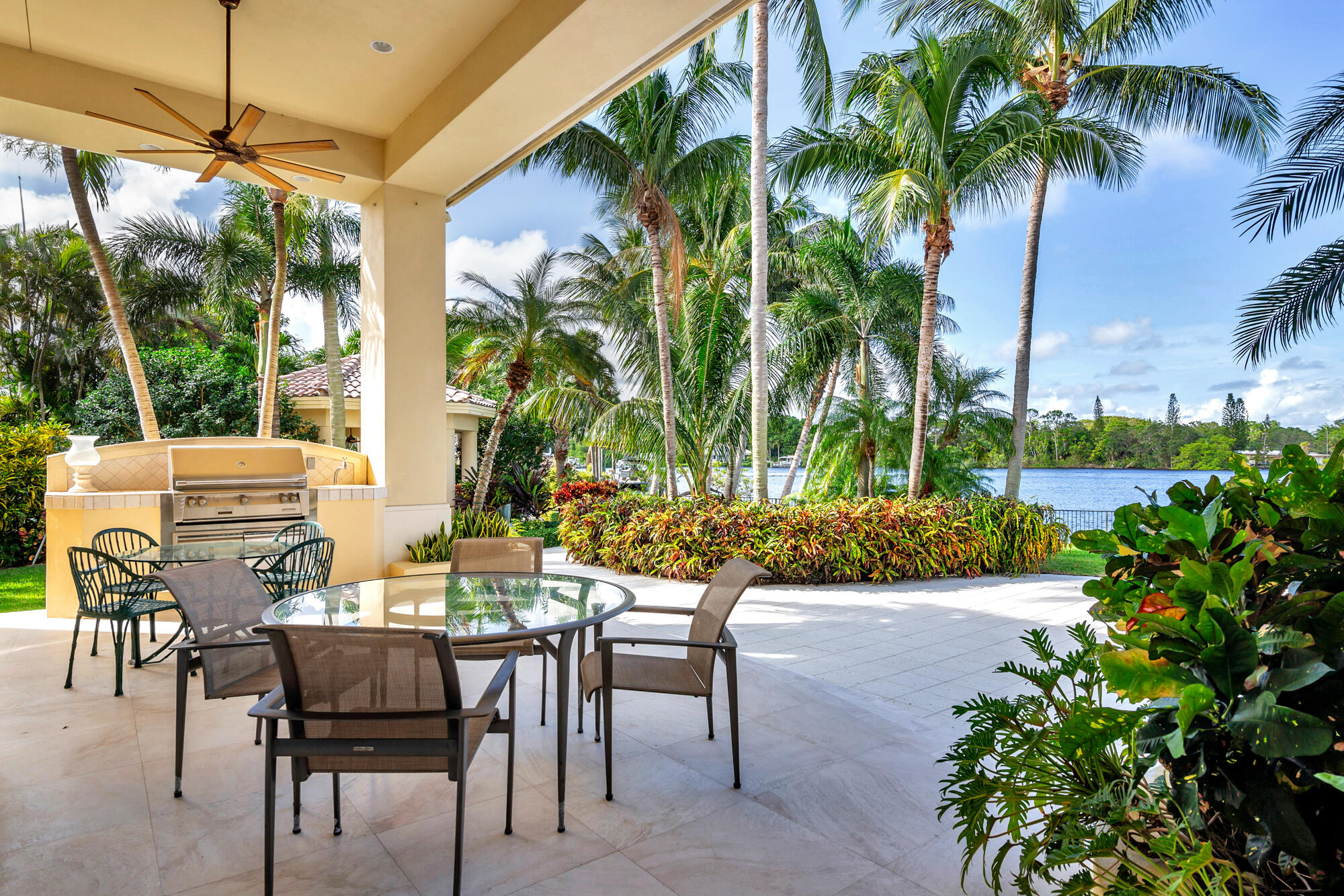 19223 North Riverside Drive Tequesta, FL 33469 - Photo 49 of 83 a view of an outdoor sitting area with swimming pool