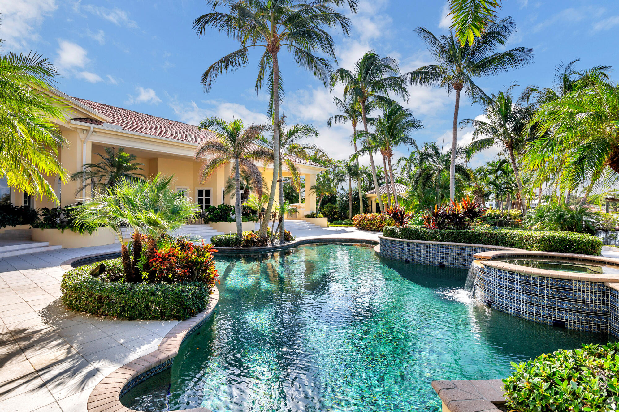 19223 North Riverside Drive Tequesta, FL 33469 - Photo 53 of 83 a view of swimming pool with a table and chairs