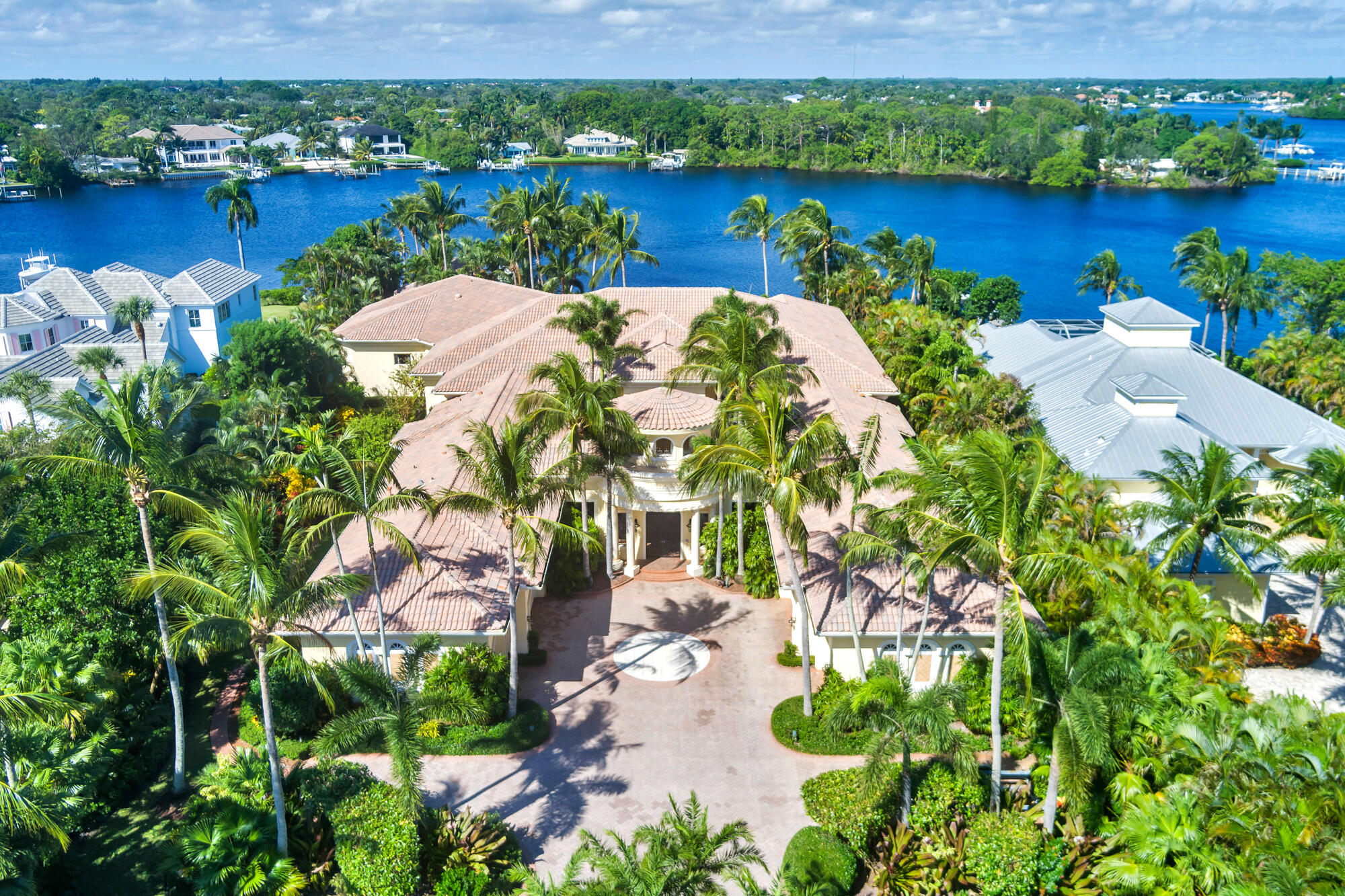 19223 North Riverside Drive Tequesta, FL 33469 - Photo 71 of 83 an aerial view of a house with a yard and lake view