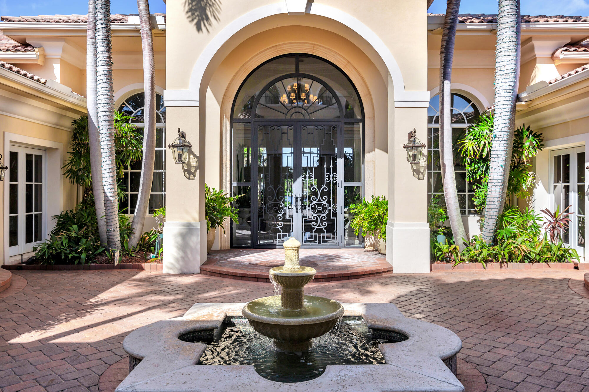 19223 North Riverside Drive Tequesta, FL 33469 - Photo 79 of 83 a view of a house with a fountain