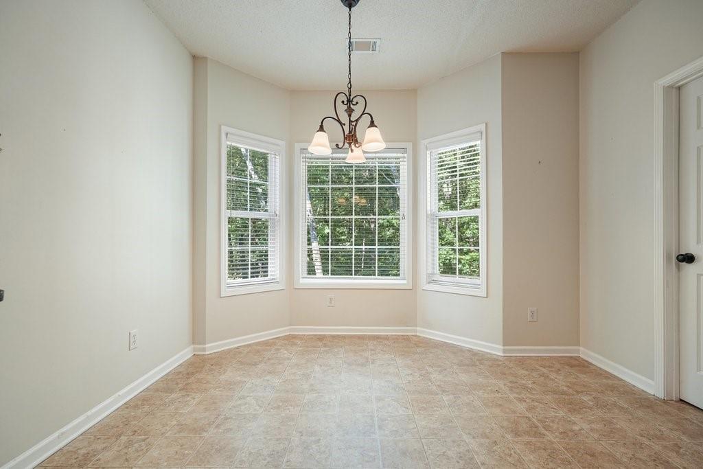 710 Bedford Trace Canton, GA 30114 - Photo 15 of 44 a view of an empty room with a window