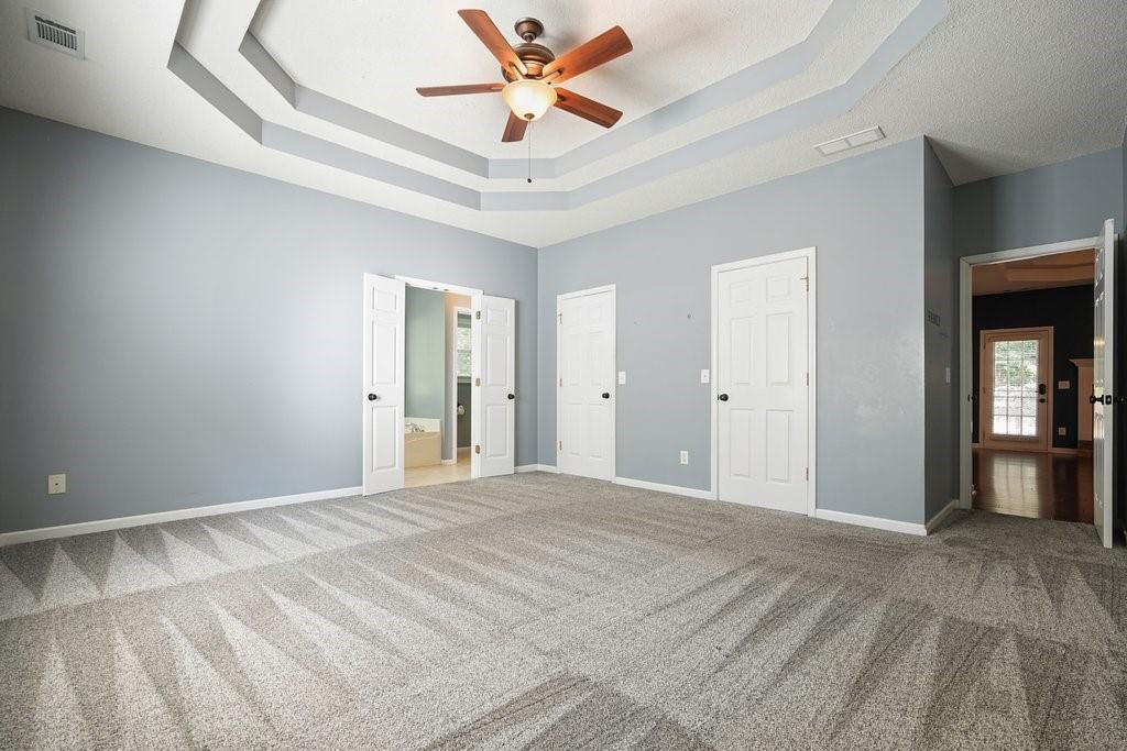 710 Bedford Trace Canton, GA 30114 - Photo 18 of 44 a view of a livingroom with a ceiling fan and window