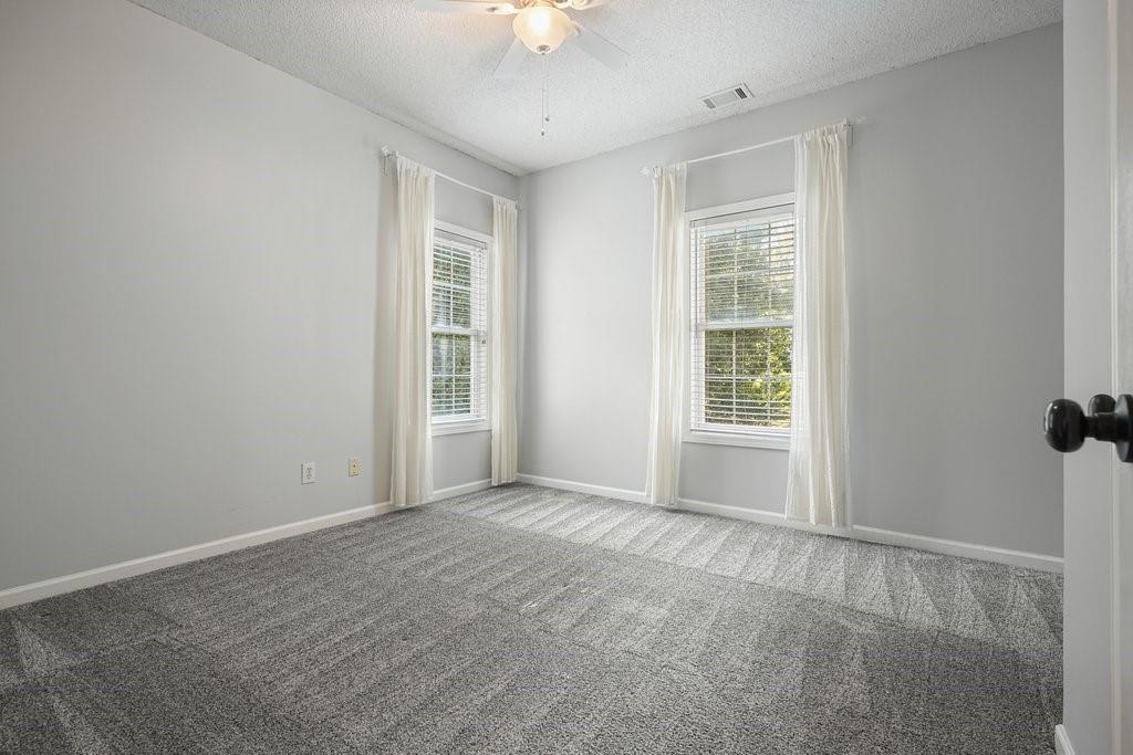 710 Bedford Trace Canton, GA 30114 - Photo 24 of 44 a view of an empty room with a window