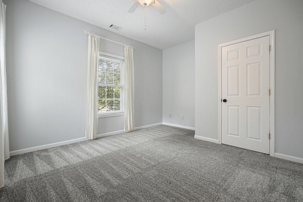 710 Bedford Trace Canton, GA 30114 - Photo 25 of 44 a view of an empty room with a window