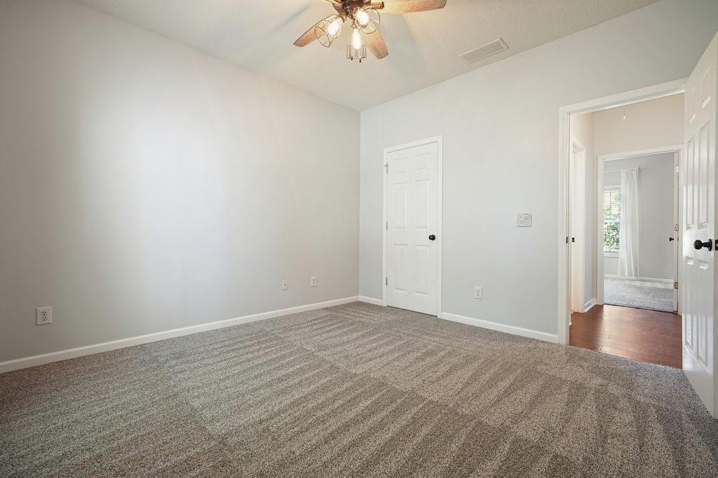 710 Bedford Trace Canton, GA 30114 - Photo 28 of 44 a view of an empty room and wooden floor
