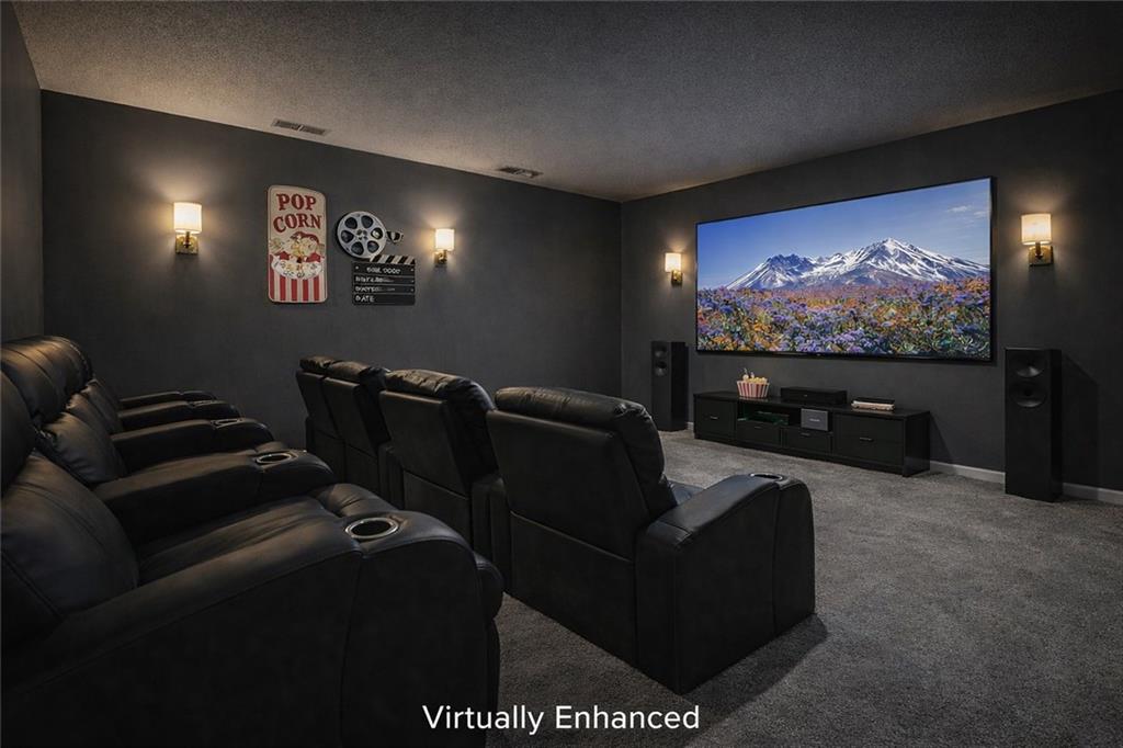 710 Bedford Trace Canton, GA 30114 - Photo 3 of 44 a media room with lots of chairs and a projector screen