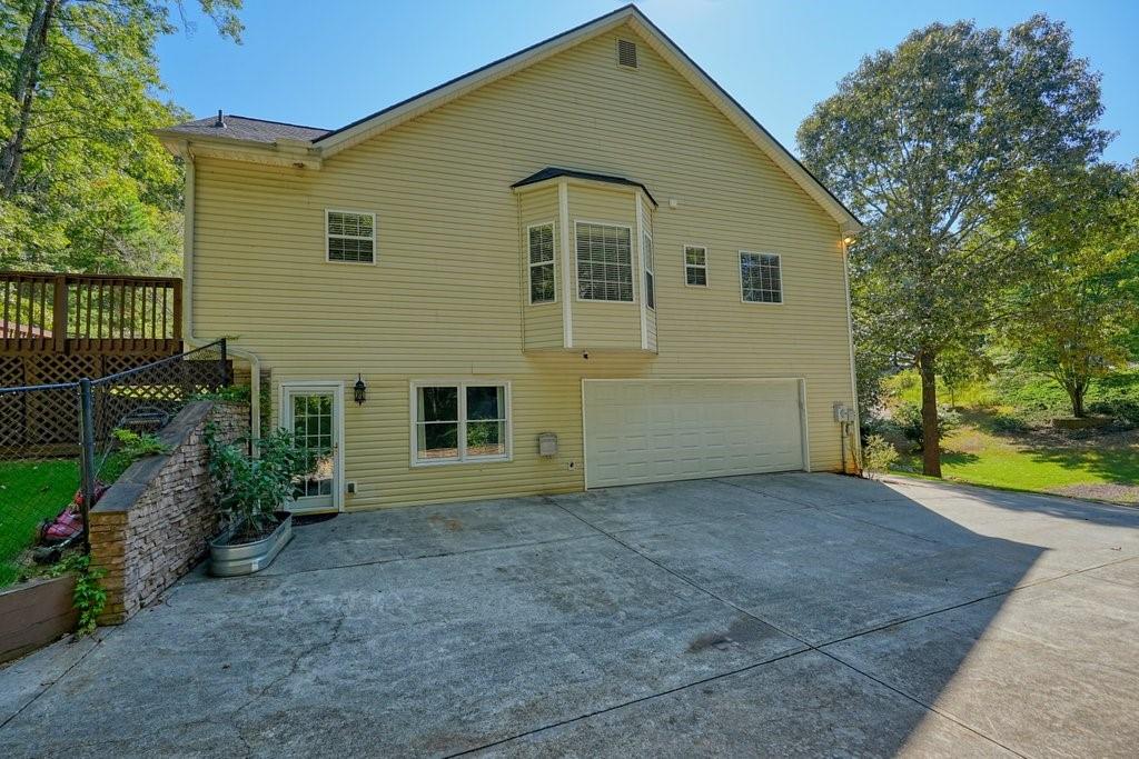 710 Bedford Trace Canton, GA 30114 - Photo 36 of 44 a front view of a house with garden