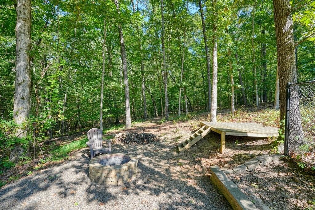 710 Bedford Trace Canton, GA 30114 - Photo 38 of 44 a backyard of a house with table and chairs