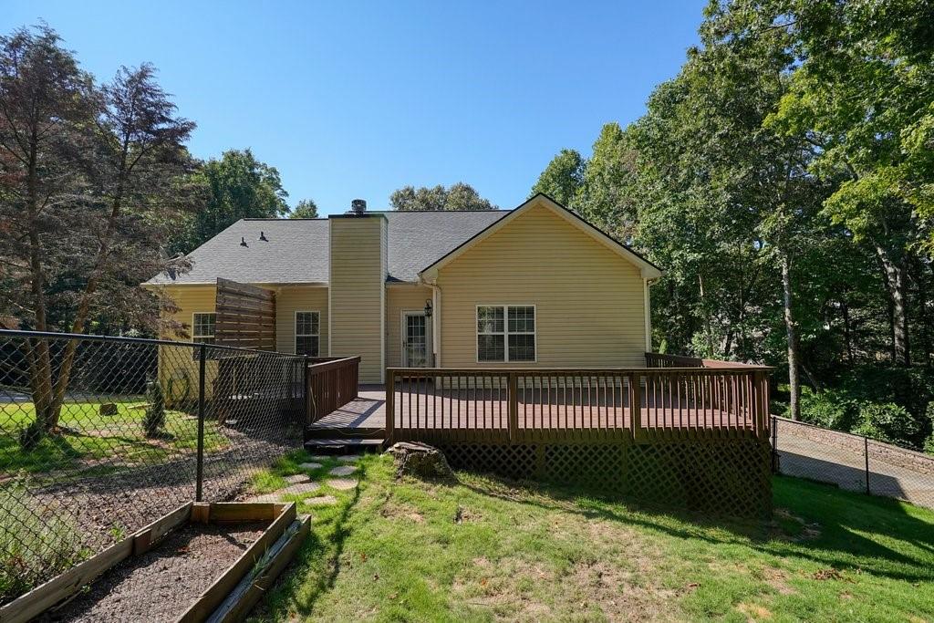 710 Bedford Trace Canton, GA 30114 - Photo 39 of 44 a view of a house with backyard and sitting area