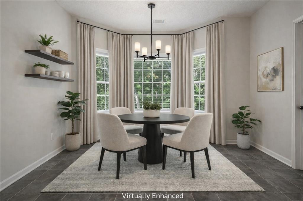 710 Bedford Trace Canton, GA 30114 - Photo 5 of 44 a view of a livingroom with furniture window and wooden floor