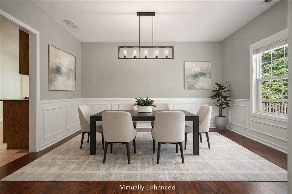 710 Bedford Trace Canton, GA 30114 - Photo 6 of 44 a view of a dining room with furniture window and wooden floor