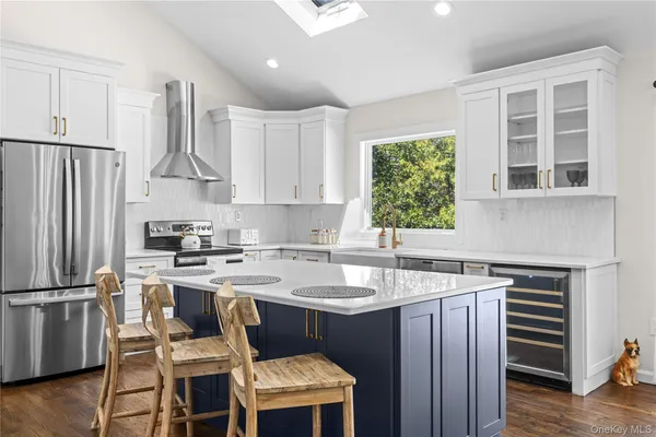 a kitchen with a sink stove and refrigerator