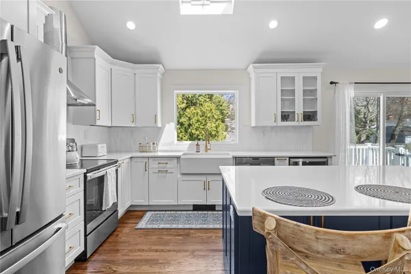 a kitchen with a stove a sink and a refrigerator