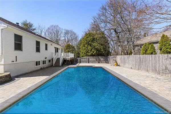 a view of a backyard with a large tree