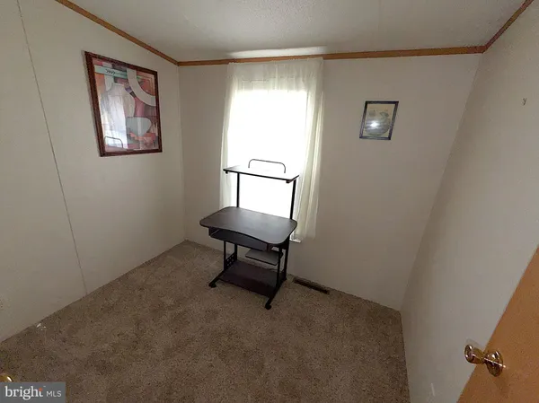 a room with furniture and a window