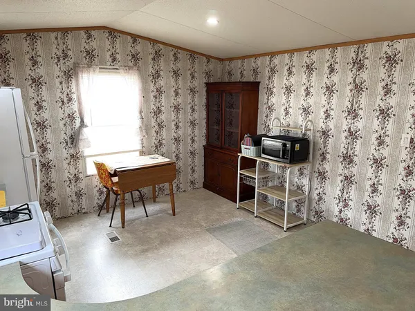 a workspace with furniture and a window