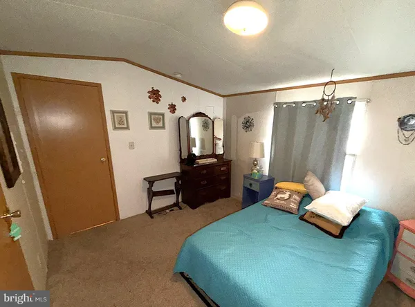 a bedroom with furniture and a wooden floor