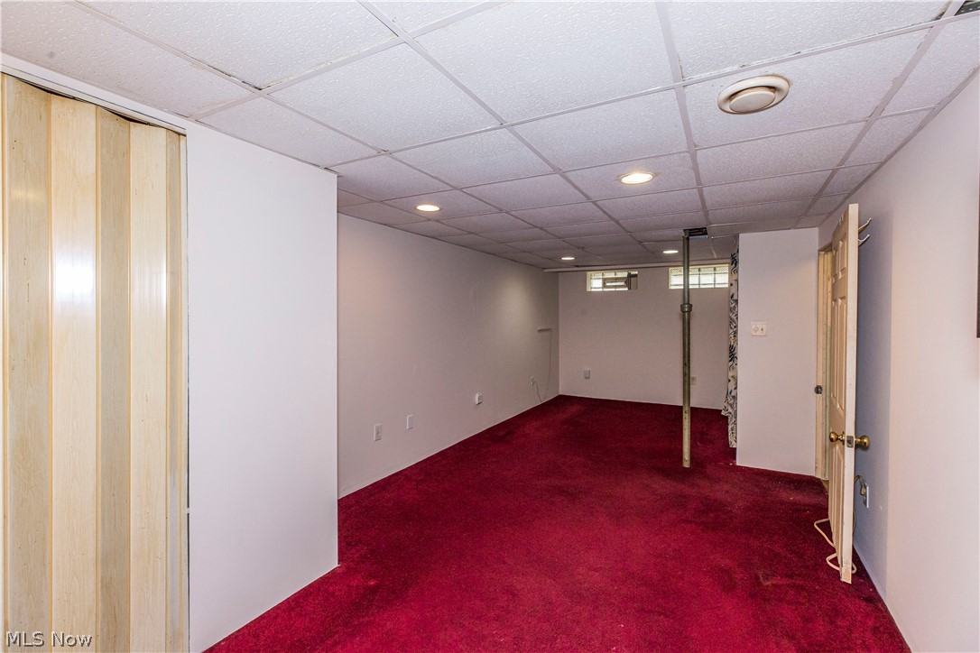 6203 Snow Road Parma, OH 44129 - Photo 21 of 29 Basement with carpet floors and a drop ceiling
