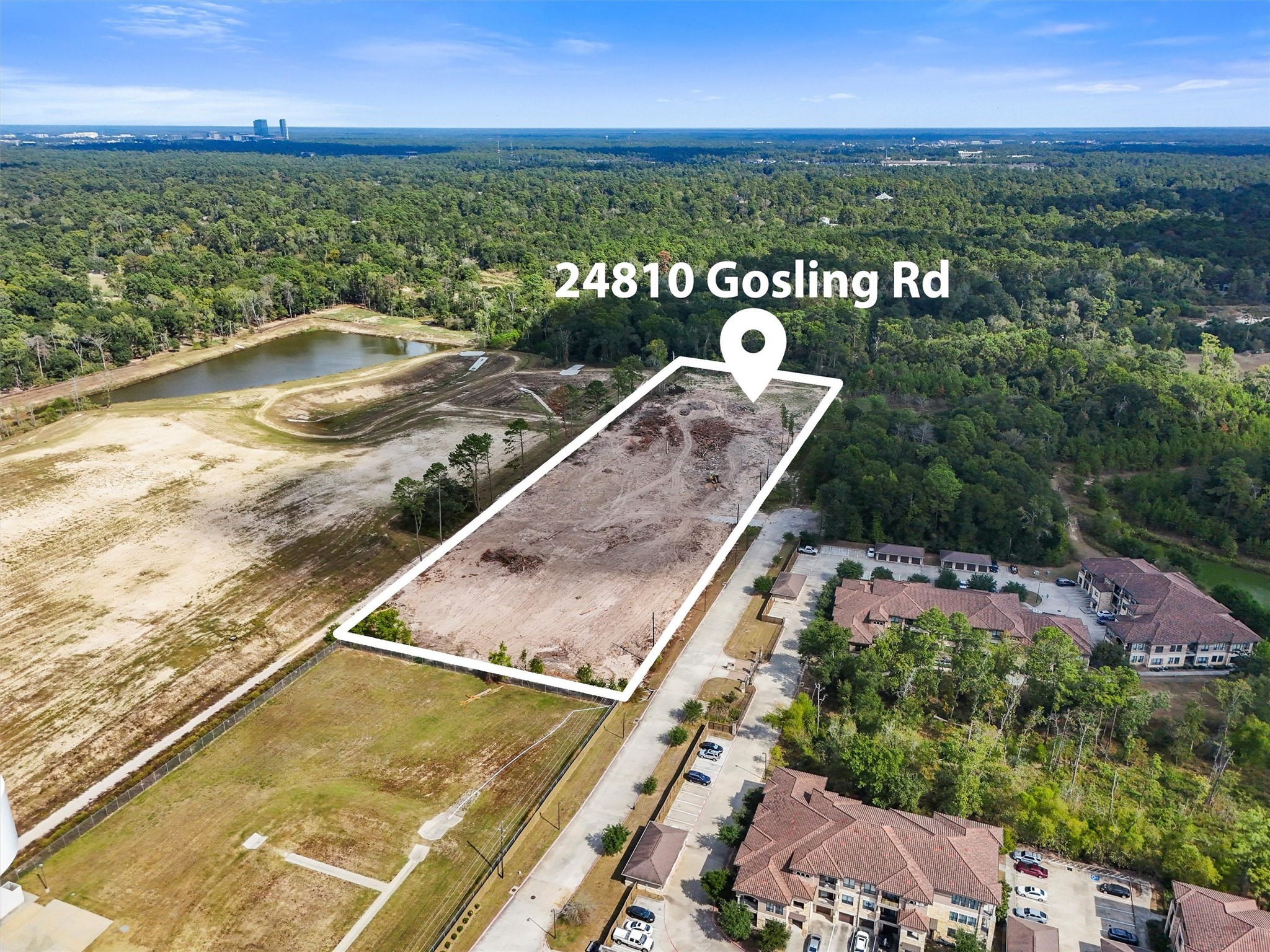24810 Gosling Road Spring, TX 77389 - Photo 5 of 22 a view of a swimming pool with a lake view