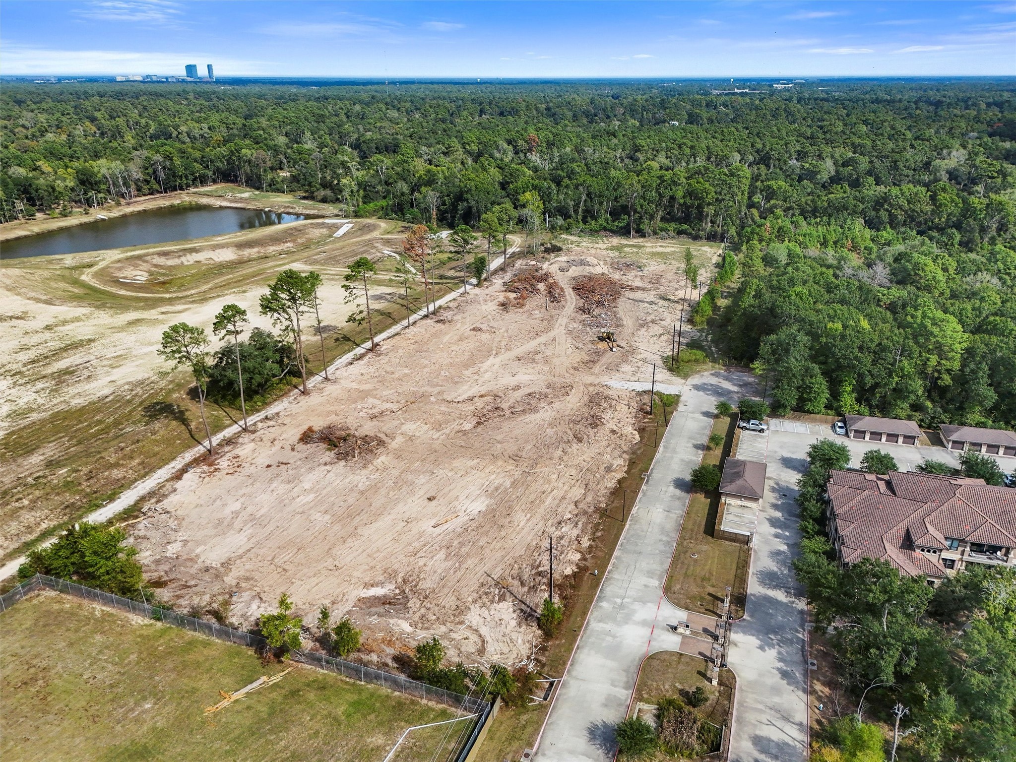 24810 Gosling Road Spring, TX 77389 - Photo 7 of 22 a view of a lake with a yard
