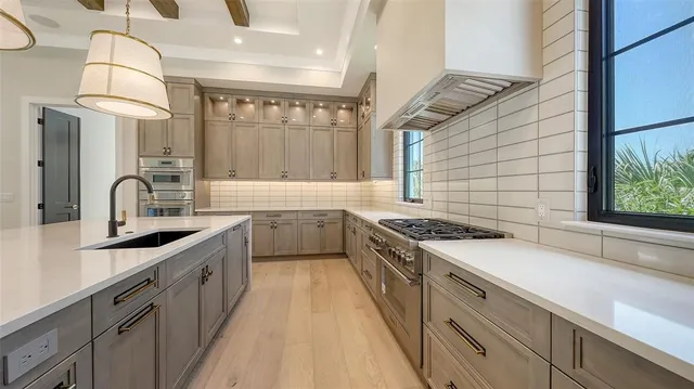 an empty room with a mirror and a window