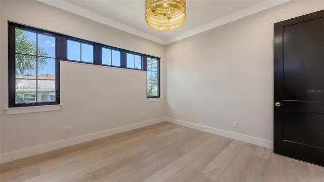 a bathroom with a granite countertop sink toilet a mirror a vanity and shower