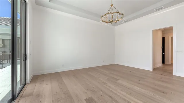 a view of house with swimming pool outdoor seating