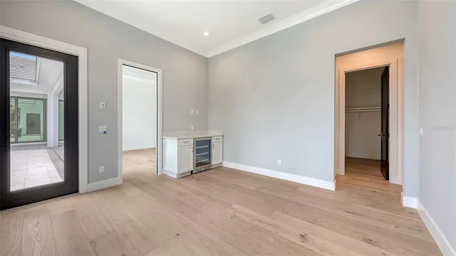 an aerial view of a house with a garden and lake view