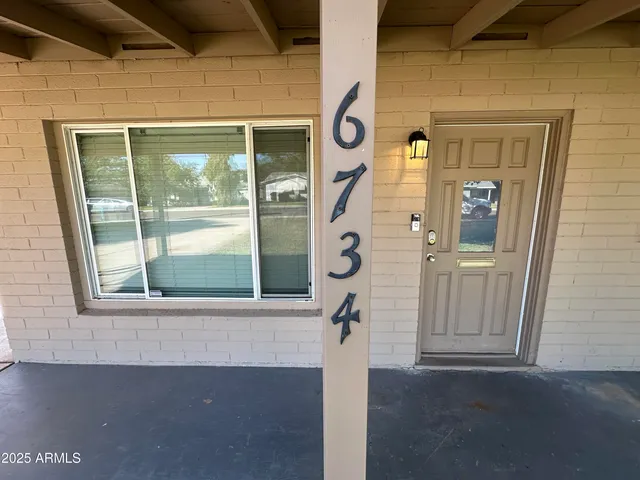 a front view of a house with a glass door