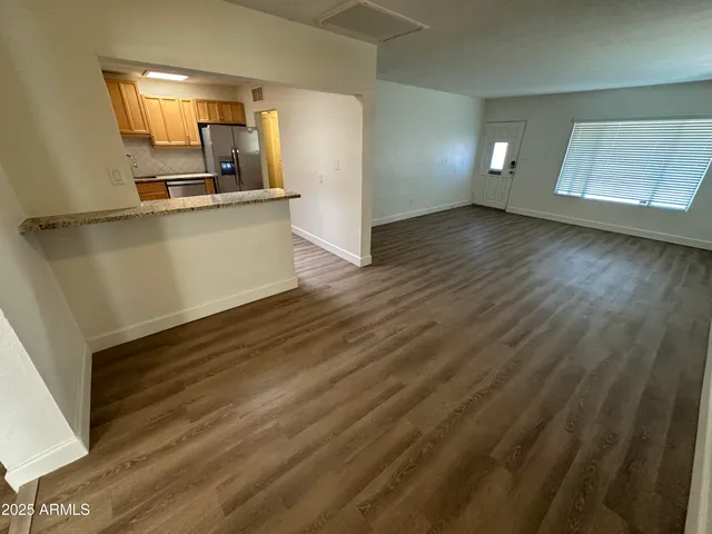 a kitchen with stainless steel appliances a refrigerator and a stove