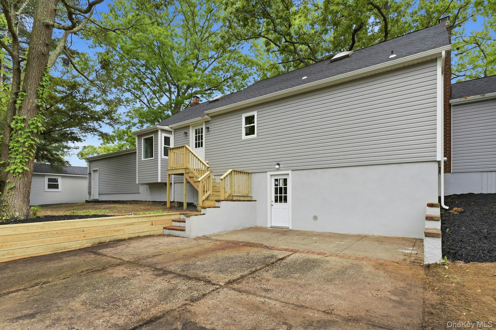 101 Rustic Road Centereach, NY 11720 - Photo 6 of 42 a view of a house with a backyard