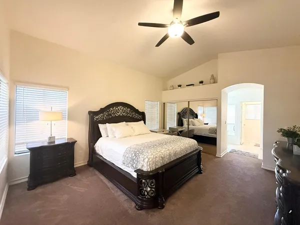 a bedroom with a bed and window