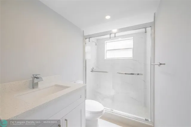 a bathroom with a shower and a toilet