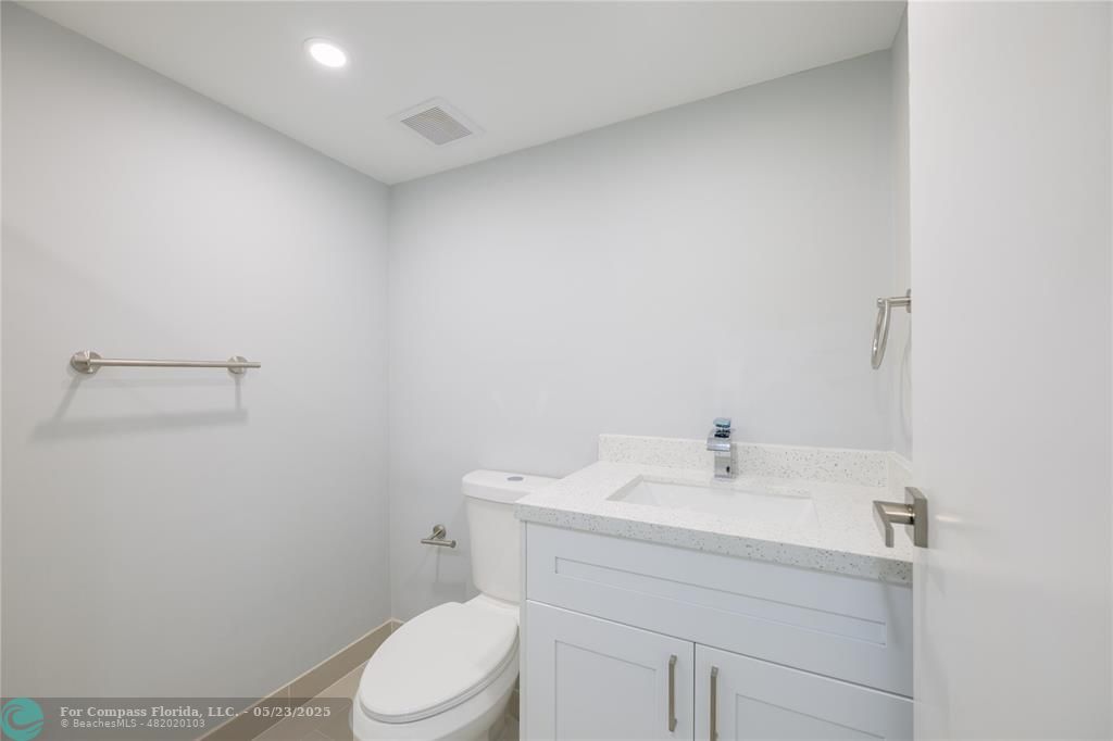 633 Brittany K, Unit 633 Delray Beach, FL 33446 - Photo 13 of 19 a bathroom with a sink a toilet and vanity
