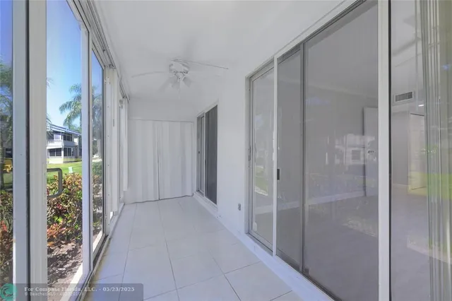 a view of a bathroom with a glass door shower