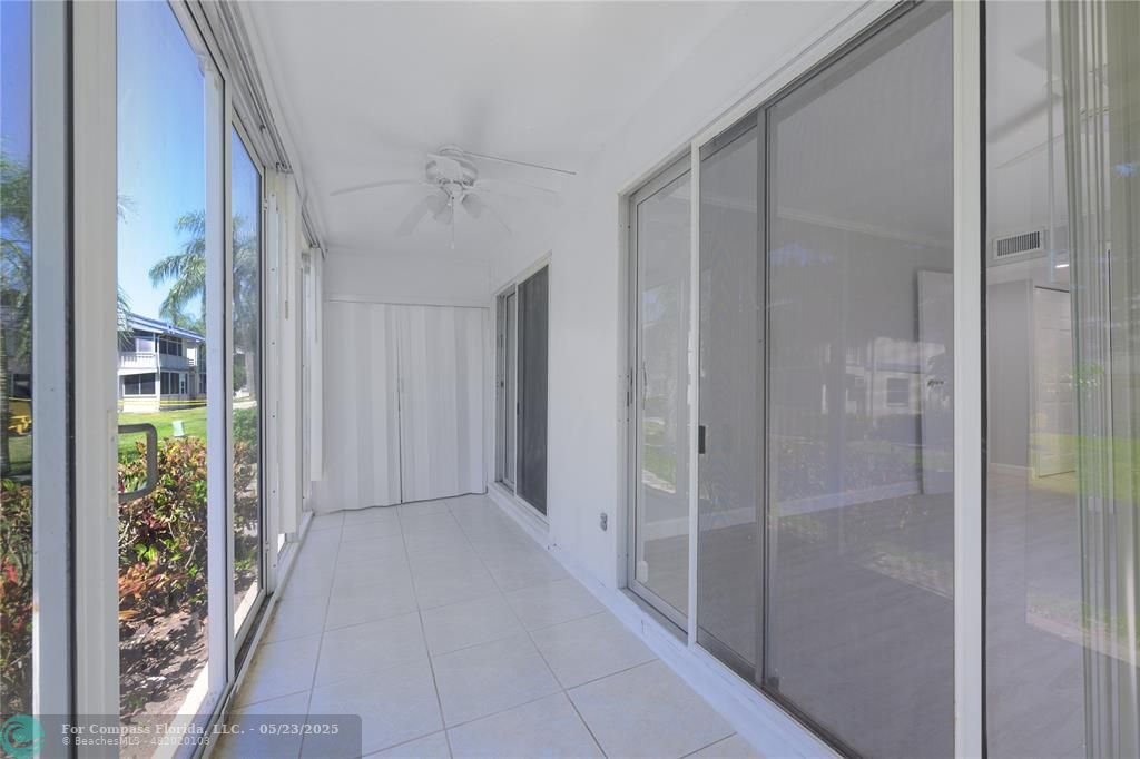 633 Brittany K, Unit 633 Delray Beach, FL 33446 - Photo 14 of 19 a view of a bathroom with a glass door shower
